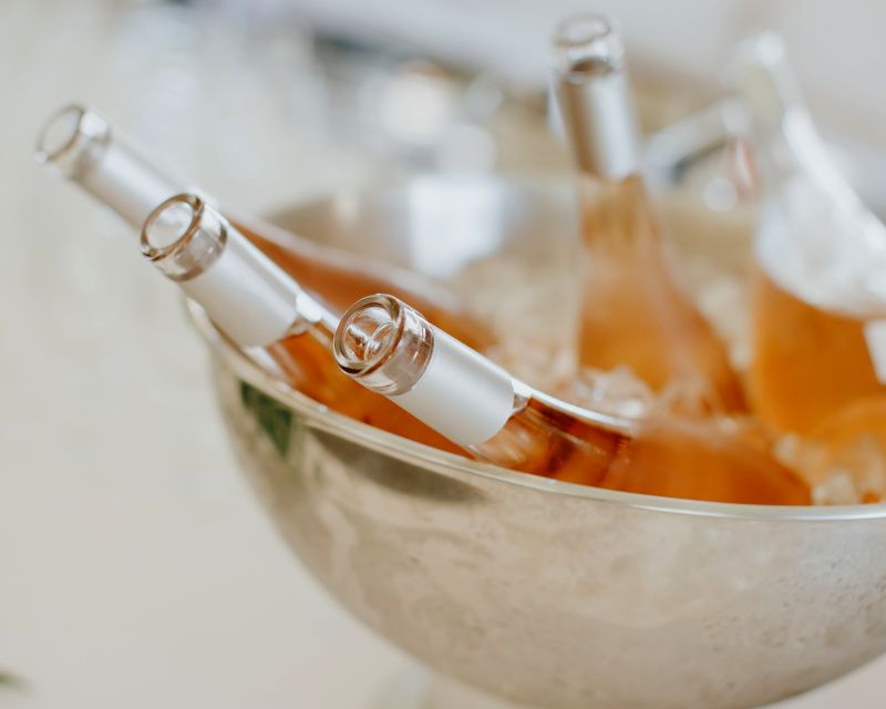 Bottles in container with ice