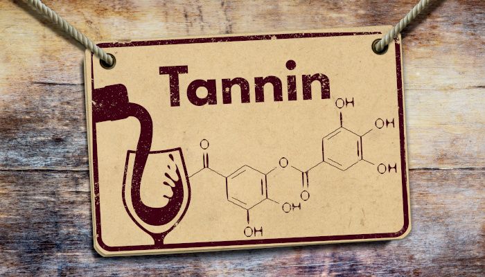Card showing the chemical formula of tannic acid, a drawing of a glass of red wine and the word Tannin.