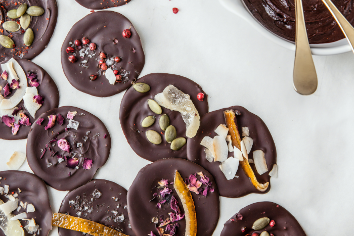 Chocolate Coated Doughnut On White Ceramic Plate. Photo by American Heritage Chocolate from Unsplash.