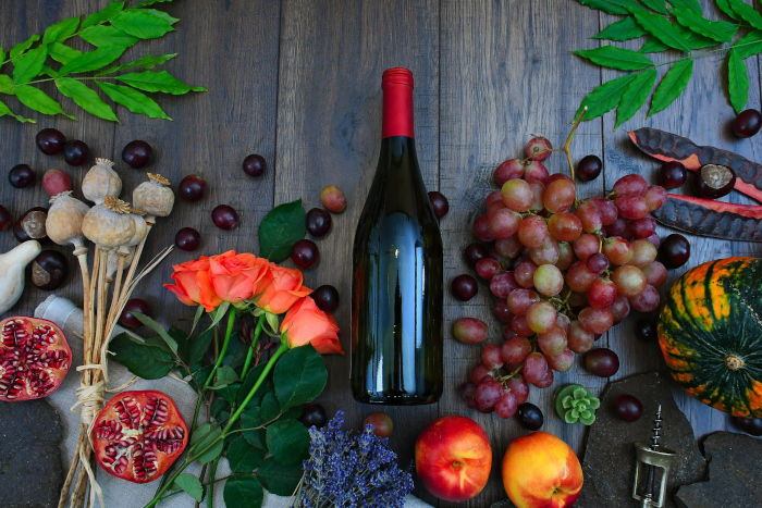 Rose , poppy , dried plant , colors , chestnut , still life , decoration , background , petal , nature ,  wine bottle , grape , peach ,  autumn still life. Image by Gábor Adonyi from Pixabay.