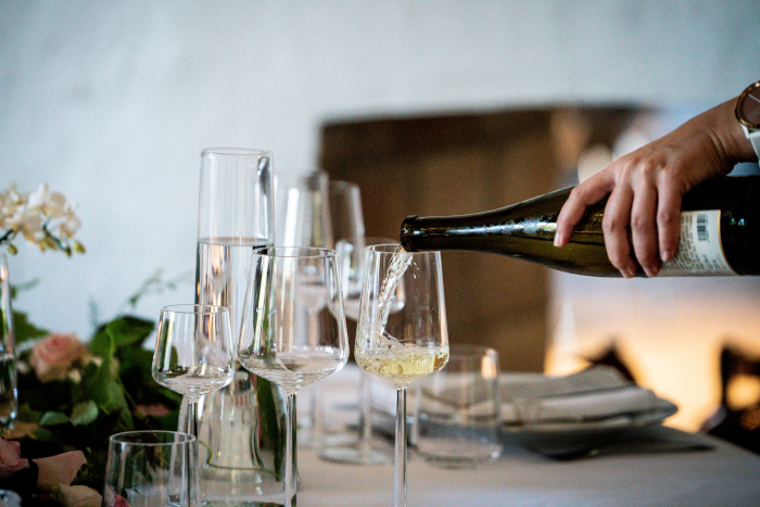 Photo Of Person Pouring Liqueur On Wine Glass. Foto by Fotograf Jylland from Pexel.s