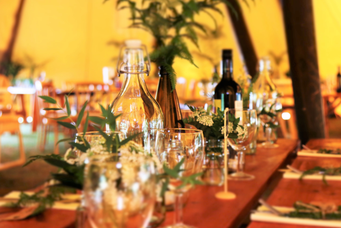 Wine Glasses and Wine Bottles on Top of Brown Wooden Table. Photo by Expect Best from Pexels.